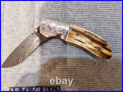 Custom folding knife by Johnny Stout