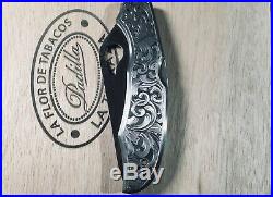 Hand engraved Spiderco CaraCara knife