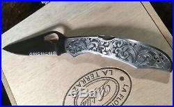 Hand engraved Spiderco CaraCara knife