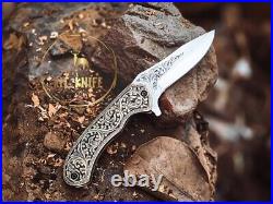 Handmade folding knife with hand engraved handle and blade