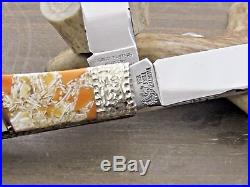LTD CUSTOM PAINTED PONY ORANGE SPINEY AND BLACK LIP PEARL TRAPPER KNIFE 1 of 5