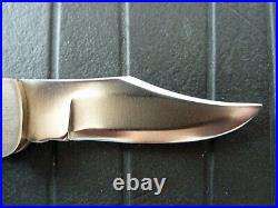 Rigid model Navajo R-37 clip point lock back folding knife