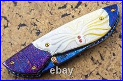 Suchat Jangtanong Custom Folding Knife Color Damascus Steel Yellow Pearl Carved